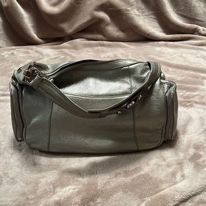 Women purse by Tignanello  gray pebbles two side pockets/ zipper